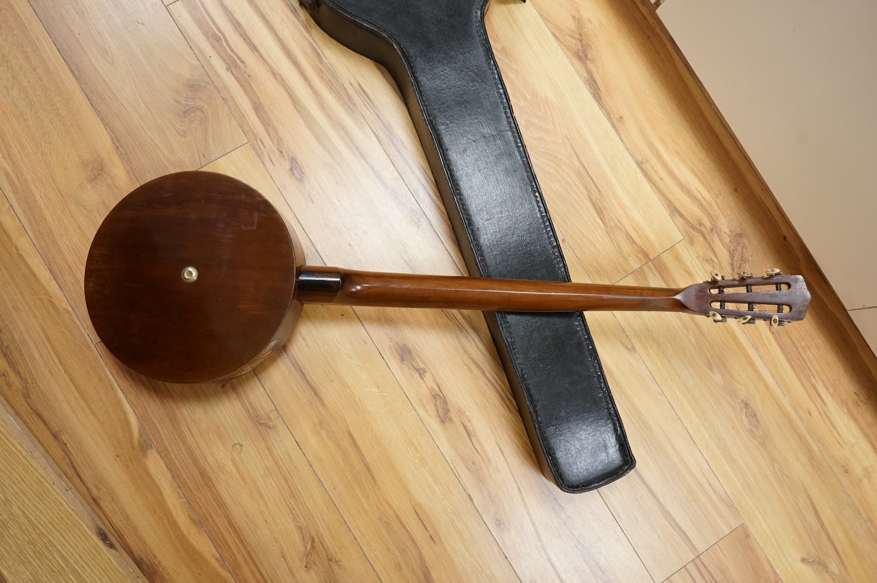 A rosewood banjo with mother of pearl inlay, cased